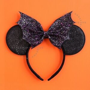 Never worn, still in plastic packaging Halloween ears.